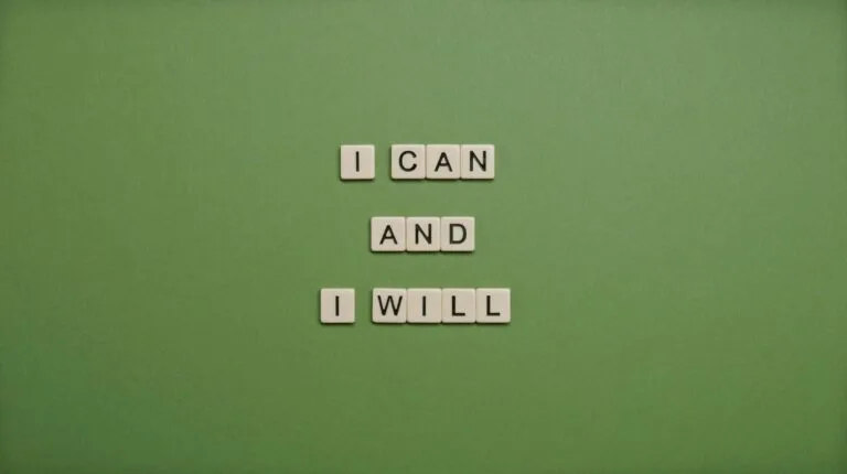 Inspirational message 'I Can and I Will' spelled with tile letters on a green background.